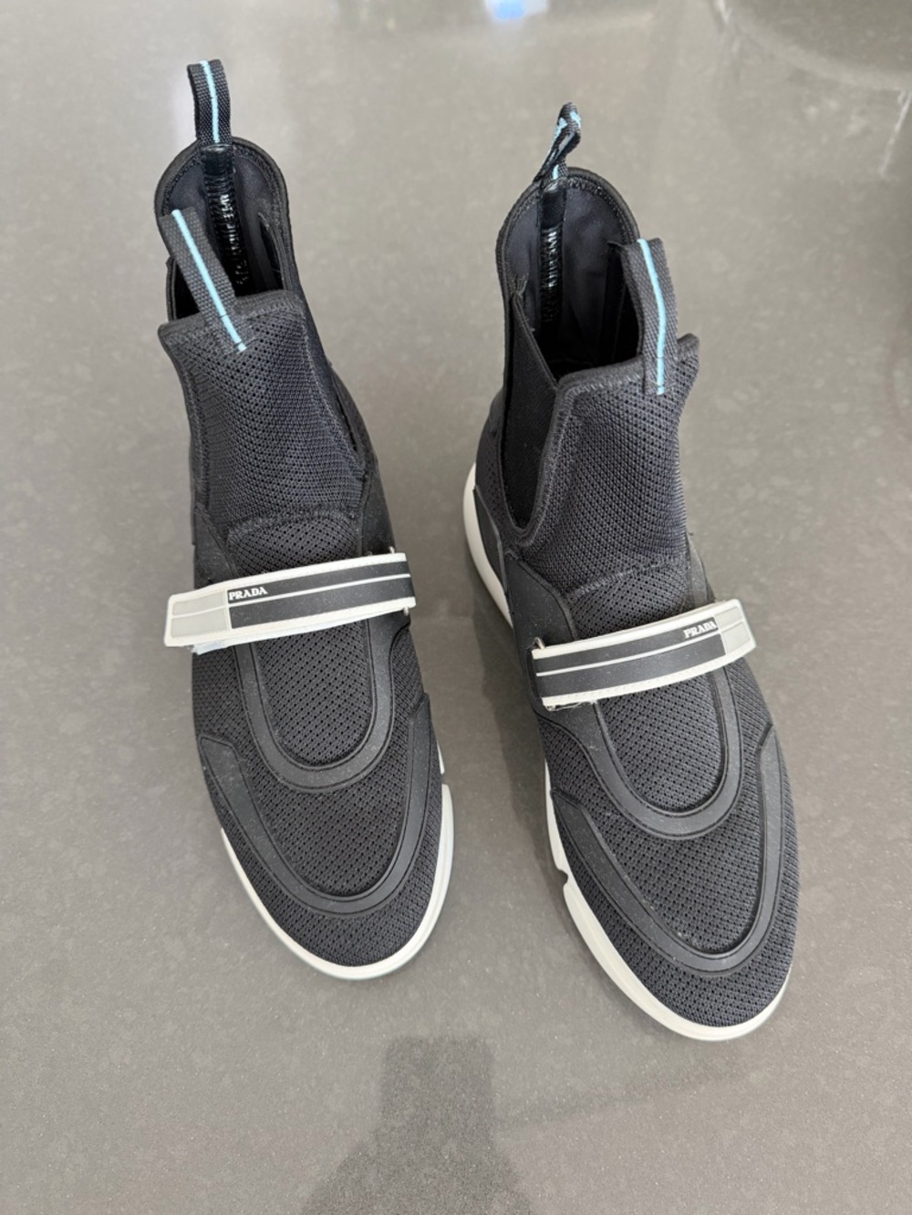 Prada women’s Black Knit High-Top Sneakers with White Accents